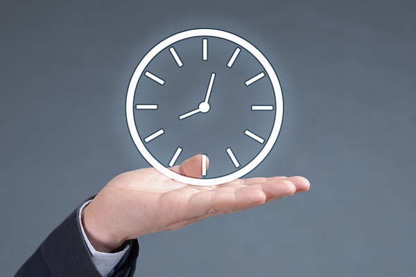 Illuminated clock in a persons hand